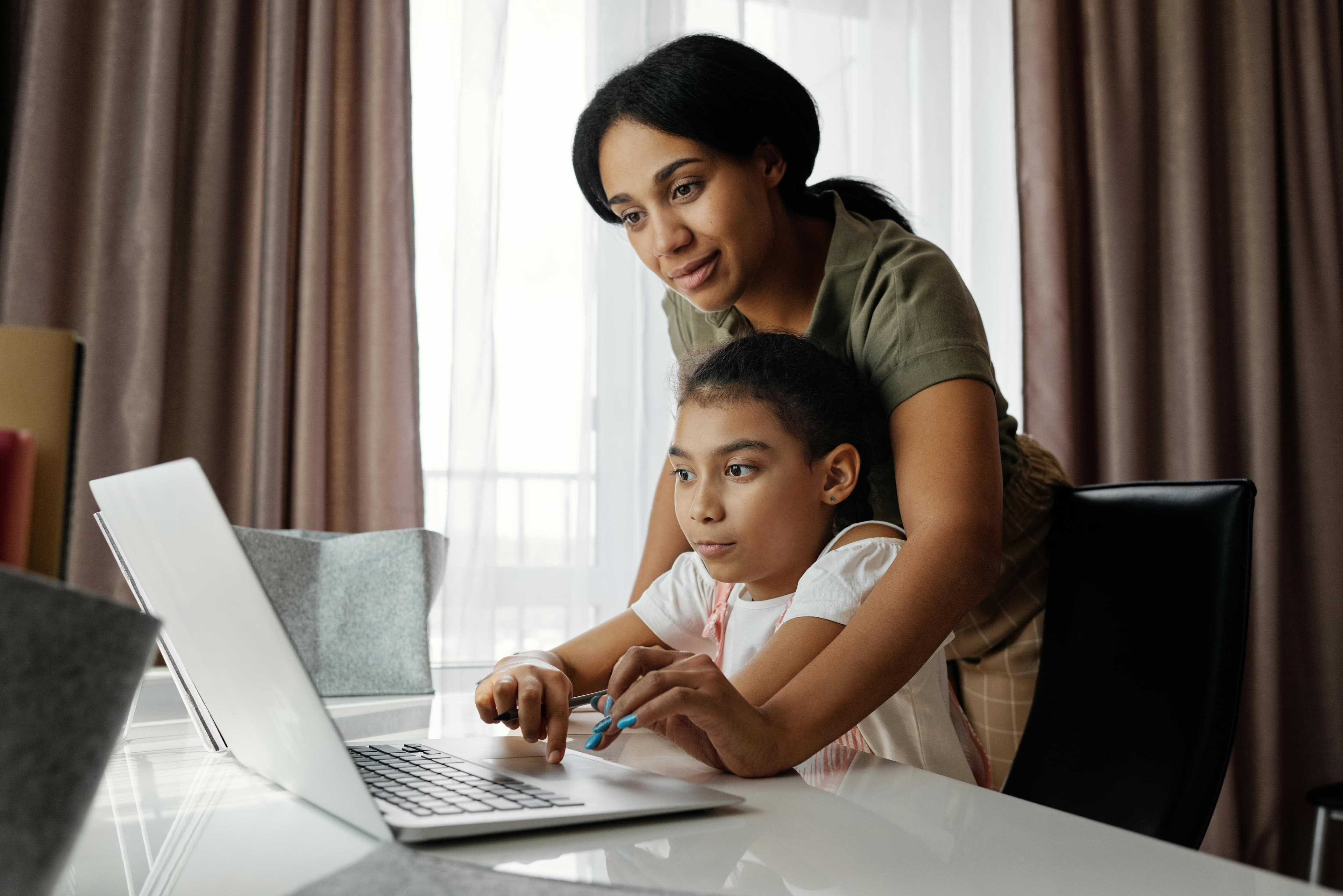 Live instructor guiding a student through coding